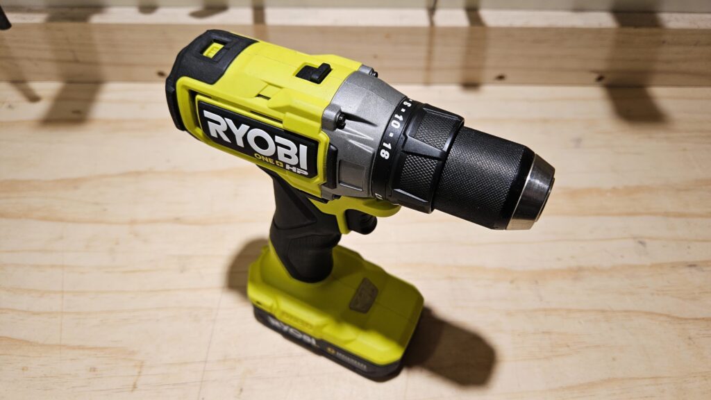 Cordless drill gearbox close-up showing internal gears and torque mechanism inside a power drill