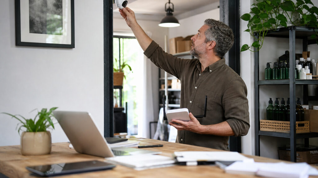 Editorial business scene illustrating wireless security camera systems and freelancer accounting software