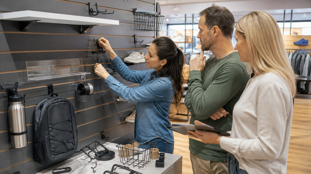 Editorial business scene illustrating slatwall display systems and enterprise accounting software