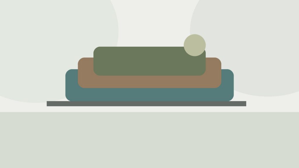 several yoga mats with different thicknesses and textures arranged in a clean practice space